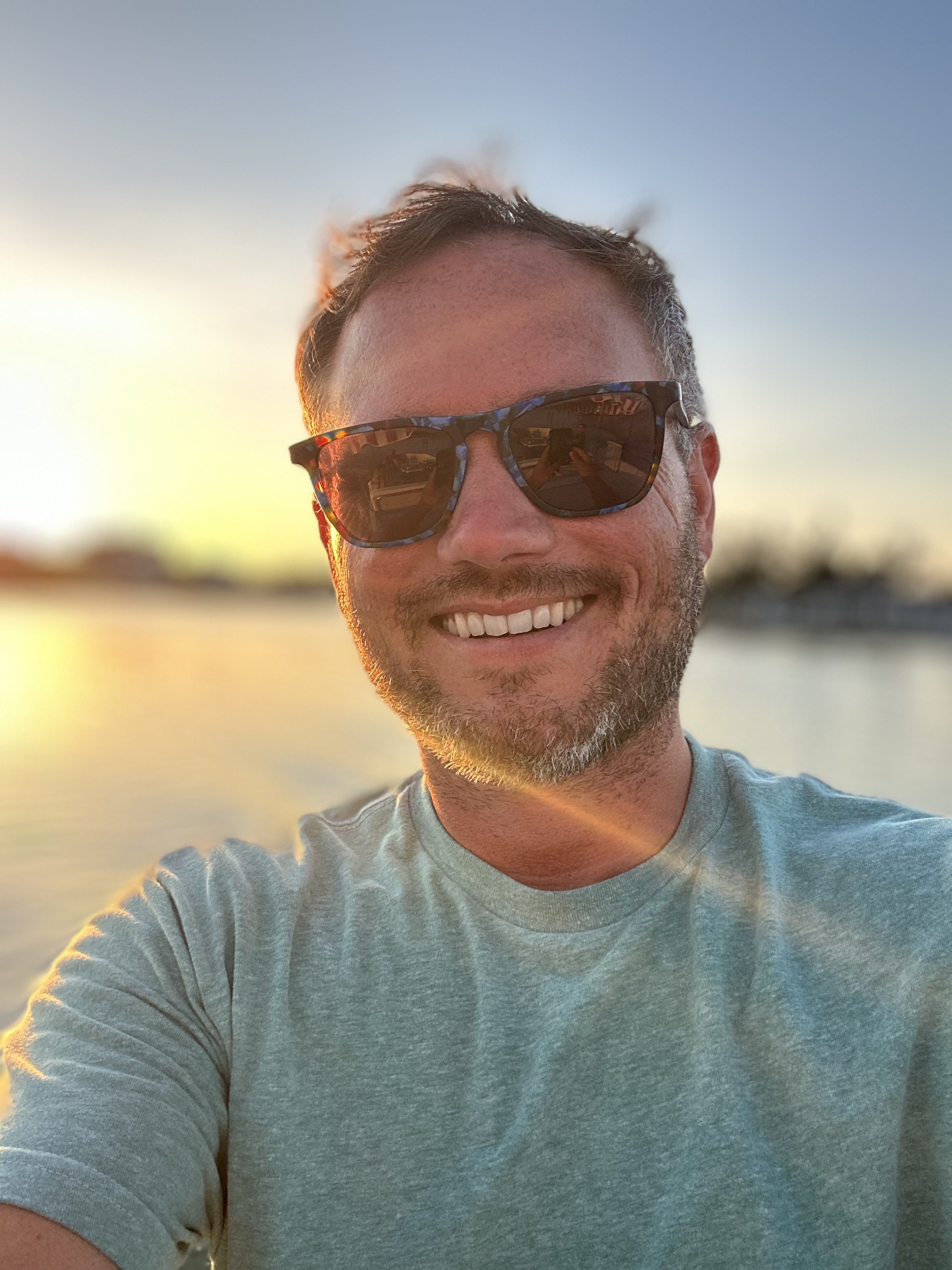 James Bake at sunset by the water in St. Petersburg, FL